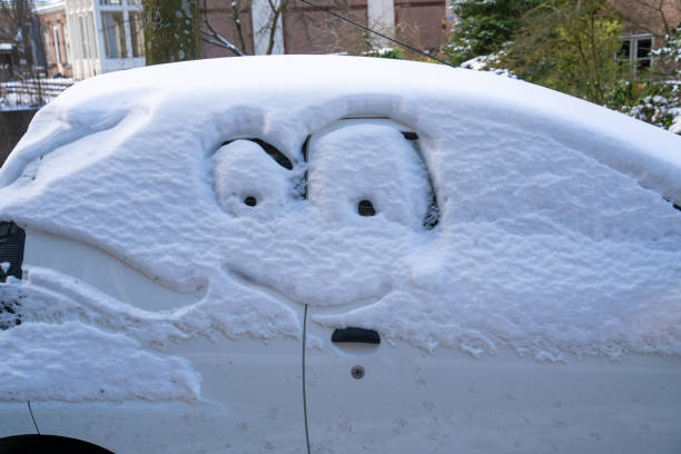 istock Car with snow and a funny face 1304216108