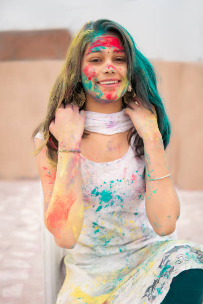 istock Indian young woman celebrating Holi. 1304217193