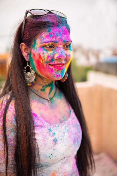 istock Indian young woman celebrating Holi. 1304217280