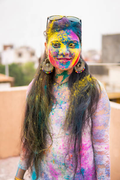 istock Indian young woman celebrating Holi. 1304217457