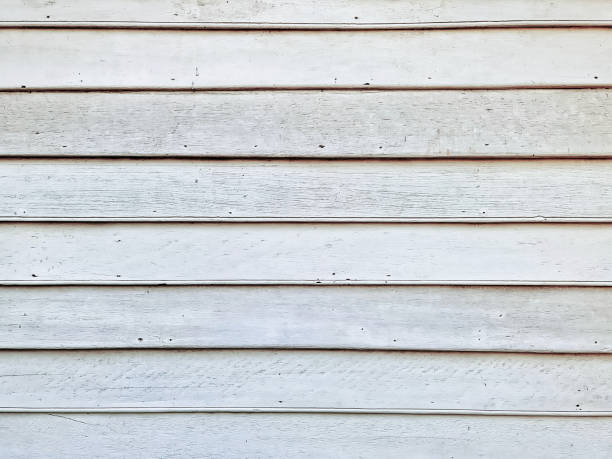 istock Full Frame Background of White Overlapping Wooden Planks Wall 1304217537