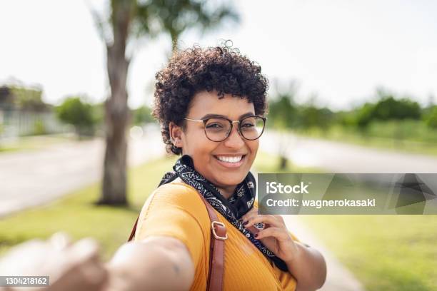 Young Woman Wearing Bandana As Protective Face Mask Stock Photo - Download Image Now