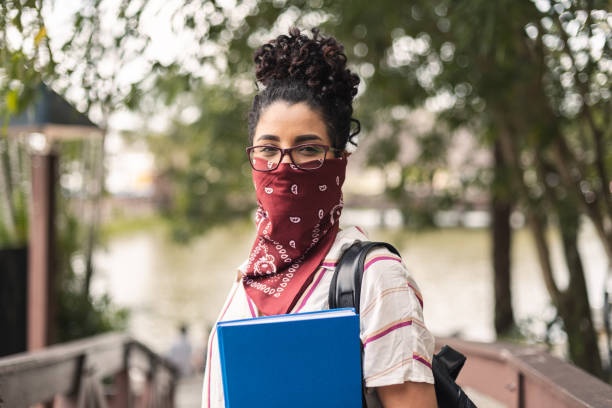 istock Young woman wearing bandana as protective face mask 1304218201