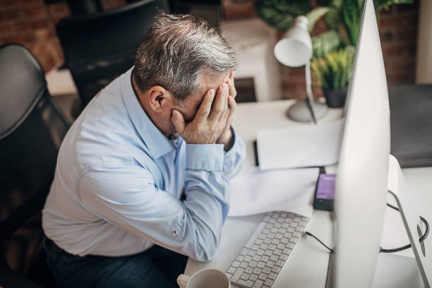 istock Worried senior man in office 1304221244