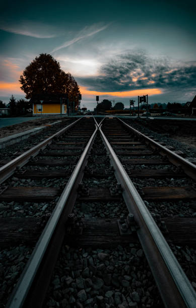 istock Railway tracks at sunrise and dawn sky 1304224722