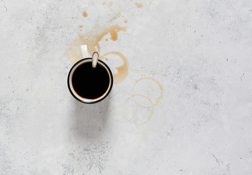 Coffee Cup for breakfast with stains on kitchen counter