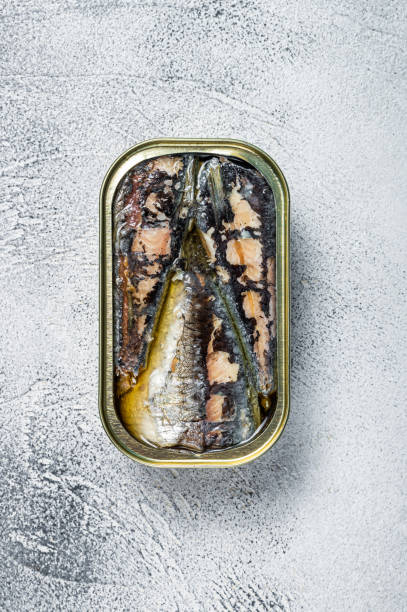 istock Open can with sardine in olive oil. White background. Top view 1304227503