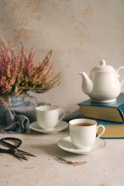 istock Still life tea time with books and flowers 1304228656