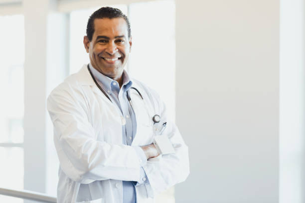 istock Successful, confident male surgeon smiles for the camera 1304228934