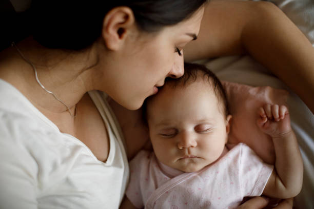 istock Mother and baby sleeping 1304231035