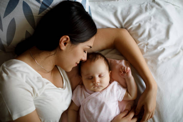 istock Mother and baby sleeping 1304231145