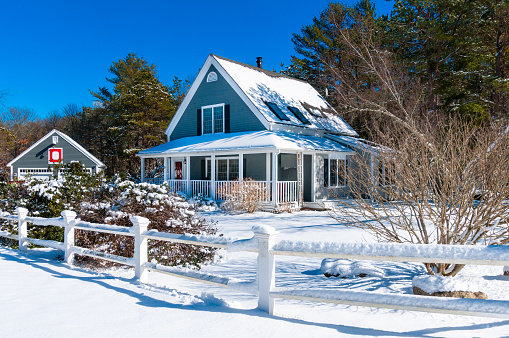 A single family home on Cape Cod after a light February snow storm