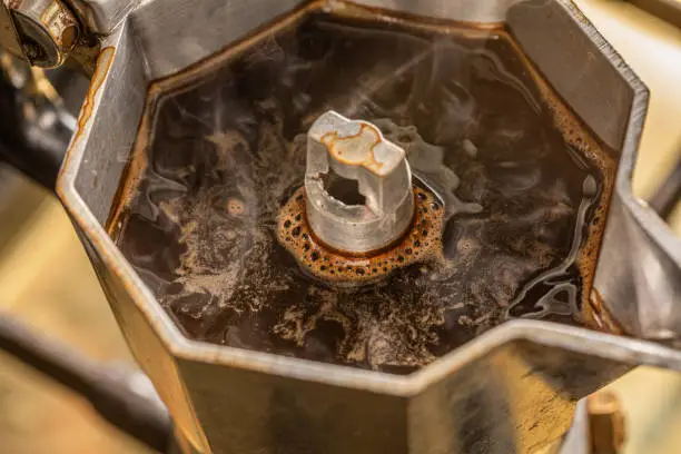 Macro view of a steaming coffee moka
