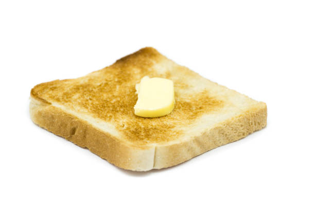 istock Toast bread with butter isolated on white background 1304234093