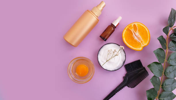 istock hair mask, comb on a colored background 1304234221