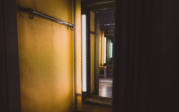 istock Clothing store changing room with mirror. 1304234358