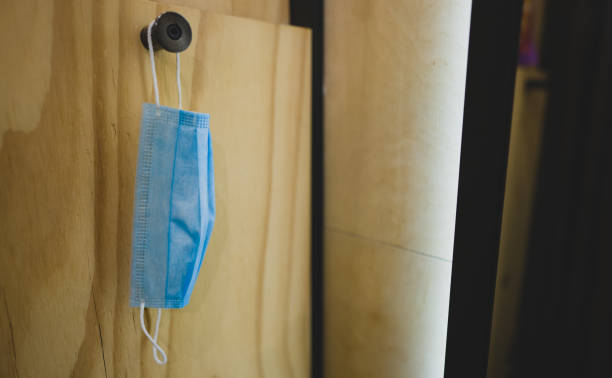 istock Used medical mask in a store changing room. 1304234368