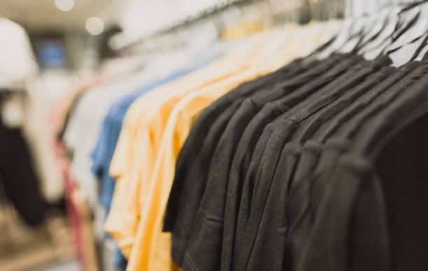 istock Rack with t-shirts in clothing store. 1304234380