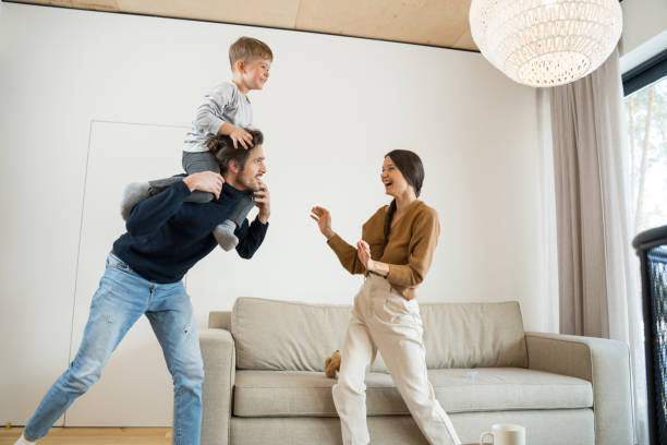 istock Couple running and playing with their children 1304234590