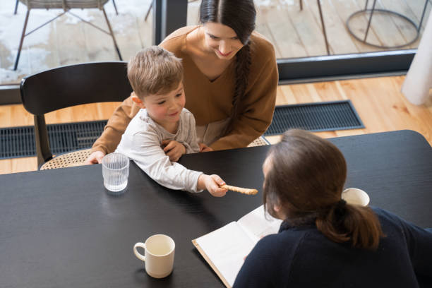 istock Little boy giving cookie to his father 1304234629