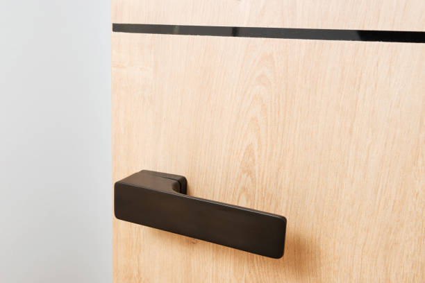 brown handle on wooden door Detail of brown handle on wooden door flush pull handles for sliding doors stock pictures, royalty-free photos & images