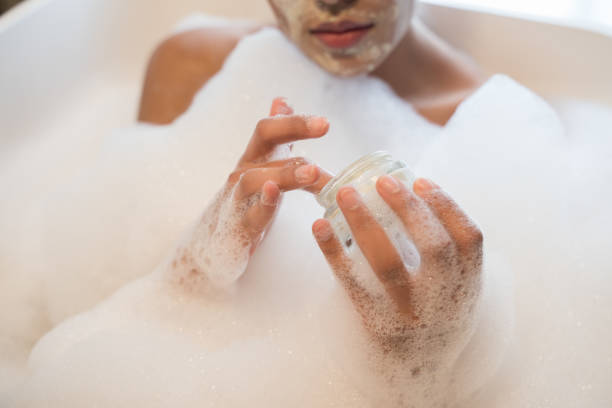 istock Female leaning on side of bath while resting there 1304240979