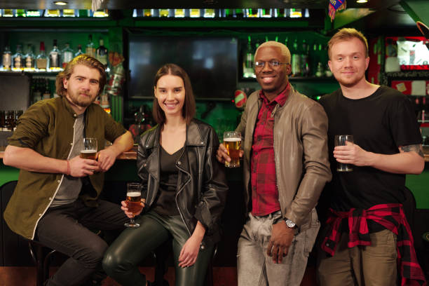istock Young people with beer in the pub 1304242623