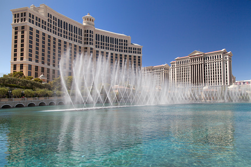 Las Vegas, Nevada - August 30, 2019: The Bellagio and nearby Caesars Palace, with the fountains of Bellagio in the foreground, Las Vegas, Nevada, United States.