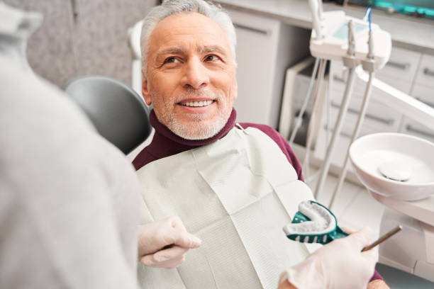 istock Dentist showing to patient dental impression 1304246401