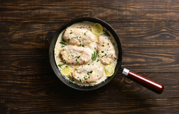istock Chicken breast in creamy garlic sauce 1304248644