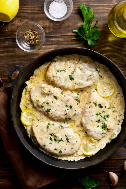 istock Chicken breast in creamy garlic sauce 1304248671