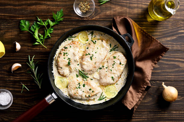 istock Chicken breast in creamy garlic sauce 1304248673