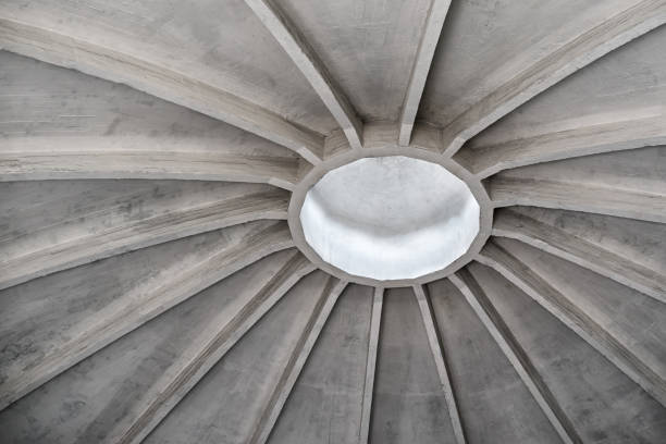 istock Fragment of a concrete dome inside an abandoned industrial building 1304249534