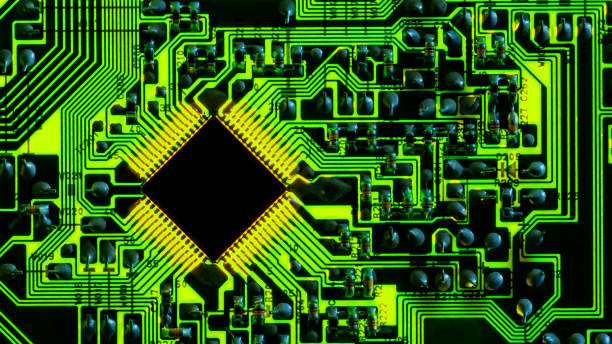 istock Full-screen texture of green backlit printed circuit board with microchip 1304249977