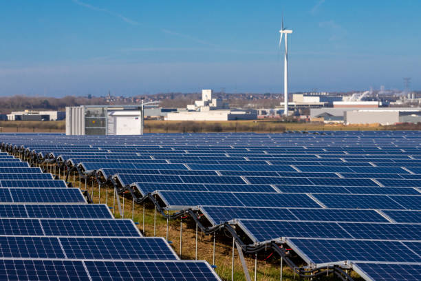 istock Innovation to meet the Sustainable Development Goals by creating solar panel fields and adding wind mill turbines to create energy near Maastricht 1304250525