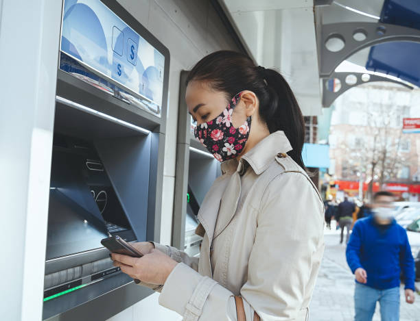 istock Withdraw money from atm in pandemic 1304250563