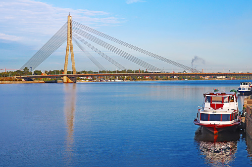 Vansu bridge over Daugava river and pleasure boats in Riga, Latvia