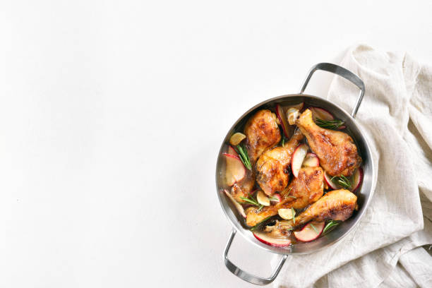 istock Chicken drumsticks baked with apples and herbs 1304250689