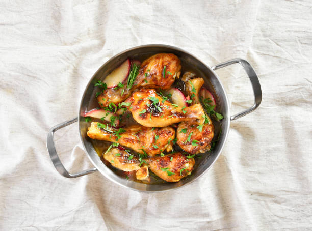 istock Chicken drumsticks baked with apples and herbs 1304250716