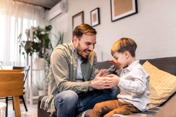 istock Happy father and son playing at home. 1304252786