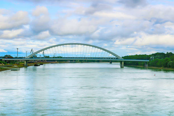 istock Modern arched Apollo bridge and Danube river in Bratislava, Slovakia 1304253848