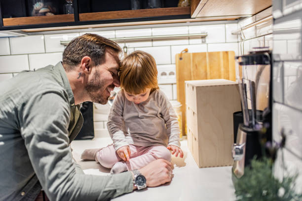 istock Happy father and little daughter playing in the kitchen. 1304254016