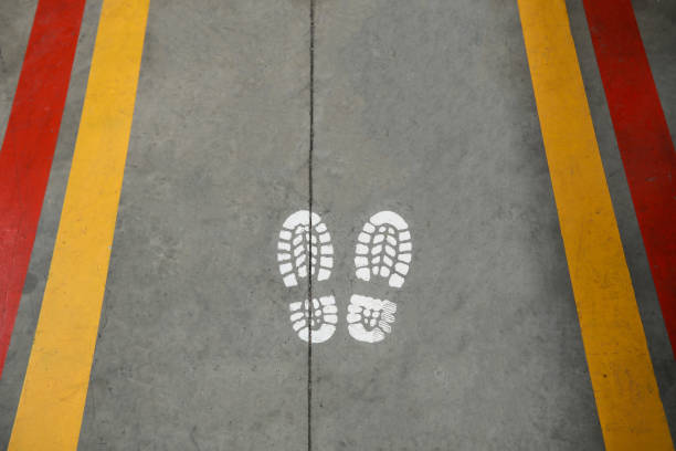 istock Walking Path Marked With Yellow And Red Lines At The Factory 1304254942