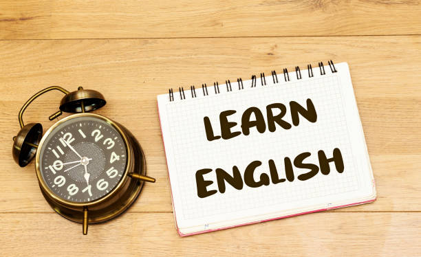 istock learn english concept on notebook with alarm clock showing 7 am or pm 1304257266