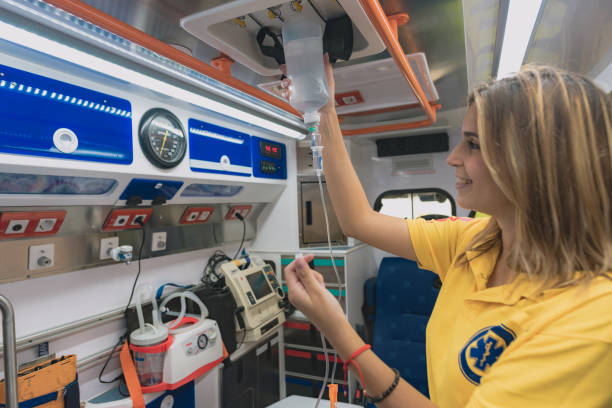 young health woman prepares an ambulance stock photo