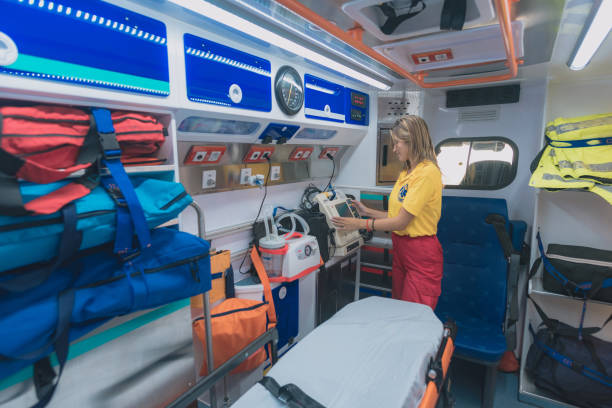 young health woman prepares an ambulance stock photo