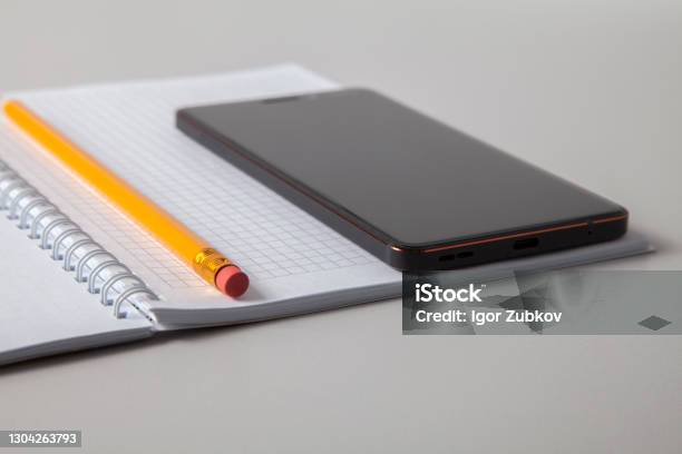 Notebook Open. Phone Open Notebook Pencil And Mobile Phone Laid Out On White Isolated ...