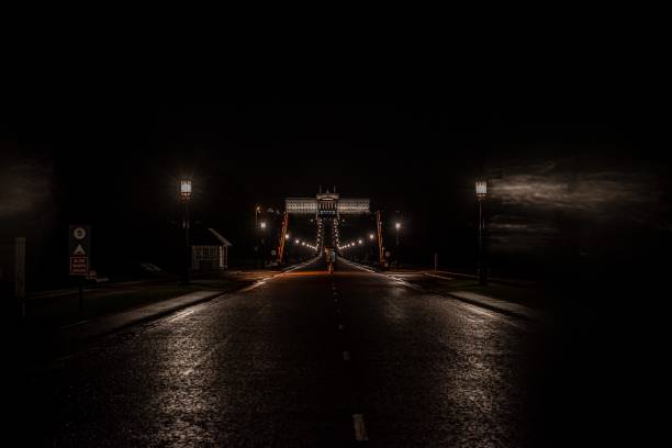 Belfast, Northern Ireland, United Kingdom - February 19, 2021: the main approach to Stormont Parliament Building, the seat of the Northern Ireland Assembly, at night.  Opened in 1932, it was built in a Greek classical style to the design of Arnold Thornely.