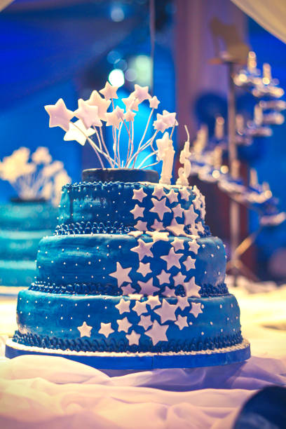 istock Beautiful and huge birthday cake decorated in a function room. 1304270638