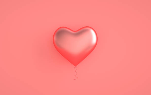 istock Pink glossy shiny balloons, heart shape on pastel pink background with reflection effect. Saint Valentine's day greeting card February 14 design. Love, wedding marriage ceremony celebration. 3d render 1304276325
